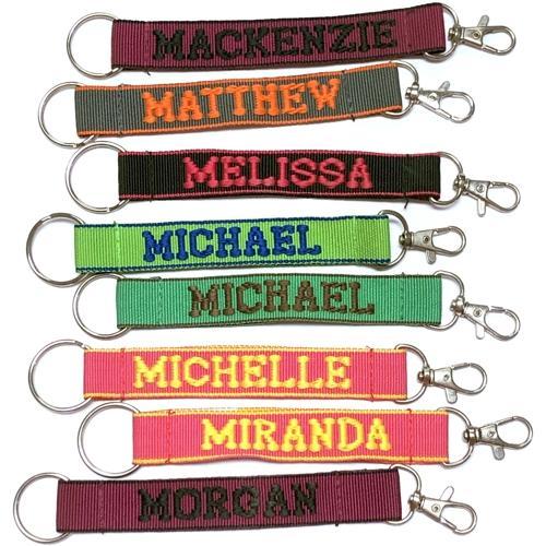 Wholesale Bundle of 100 - Embroidered Novelty Keychains - Nylon Key Strap & Clip (1" x 7.75") Assorted Names & Phrases - Dollar Fanatic